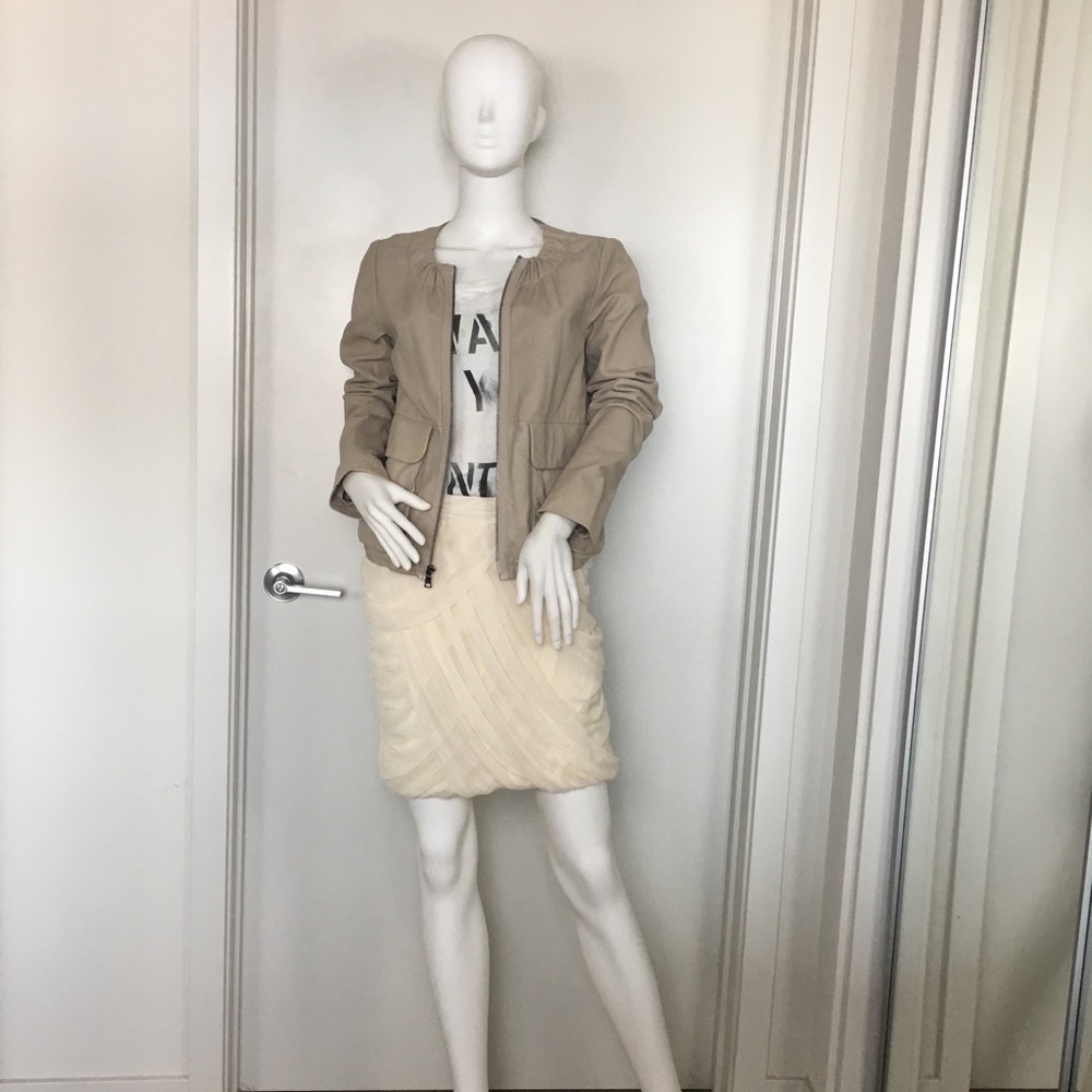 Flirty, fluffy pale apricot skirt.